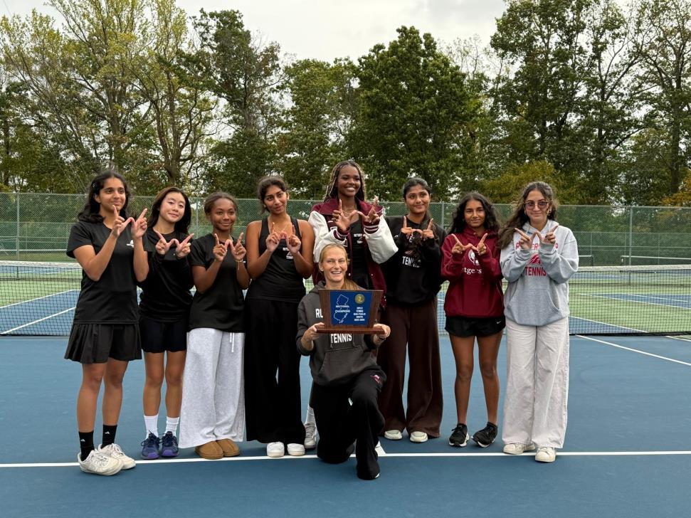 Varsity tennis team together on court