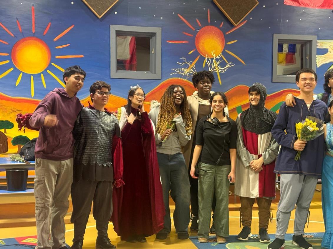 Students together on a theatre set